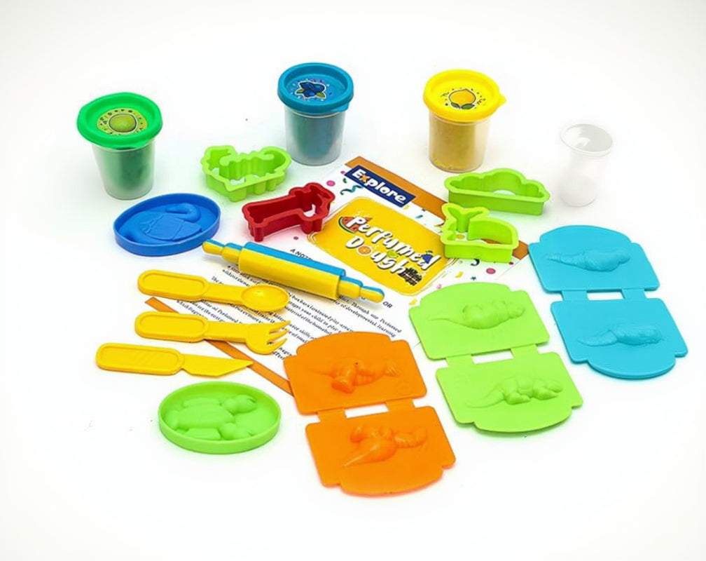 Assorted plastic modeling tools and playdough containers on a white background